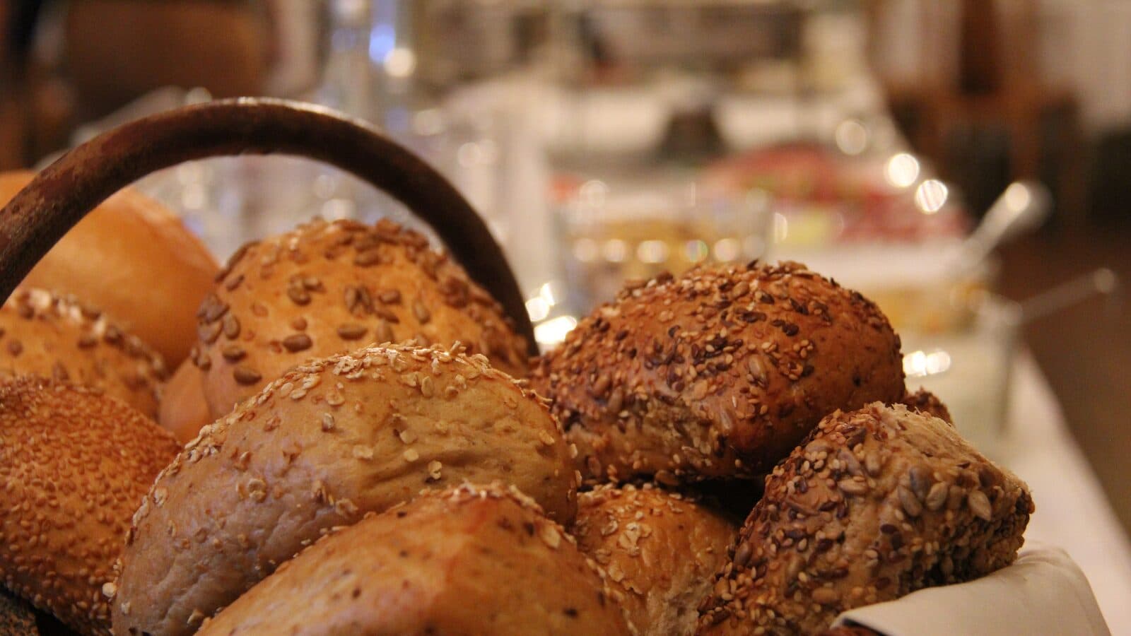 Basket of grain and sesame rolls on the breakfast table at Vitalhotel Schulenberg
